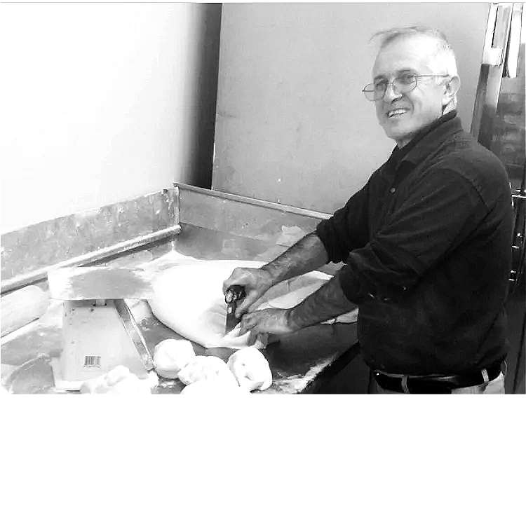 Mike hand-making fresh pizza dough at Guido's